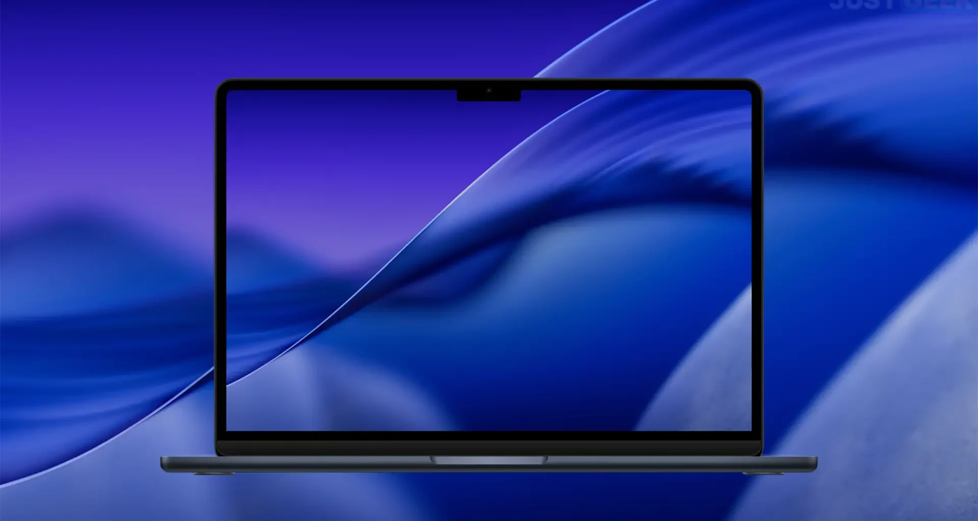 Aperçu du fond d’écran macOS Tahoe 26 en mode sombre affiché sur un MacBook