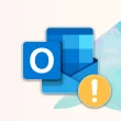 Logo Outlook avec icône de panne sur fond coloré - vérifier l’état des services Microsoft